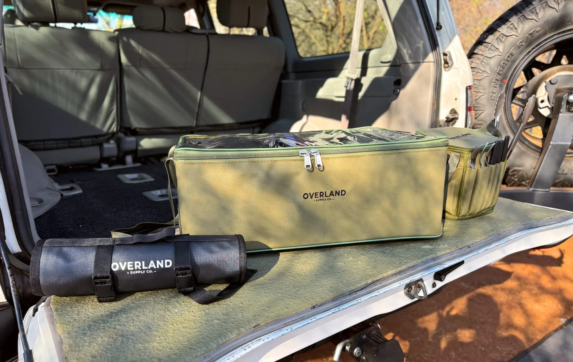 Die Trommel, the Tool Roll and the Alles Sakkie on the tailgate of a Land Cruiser